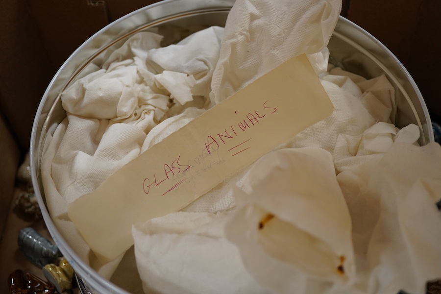 A large collection of Wade Whimsies including Disney Characters and a collection of blown glass animal figures